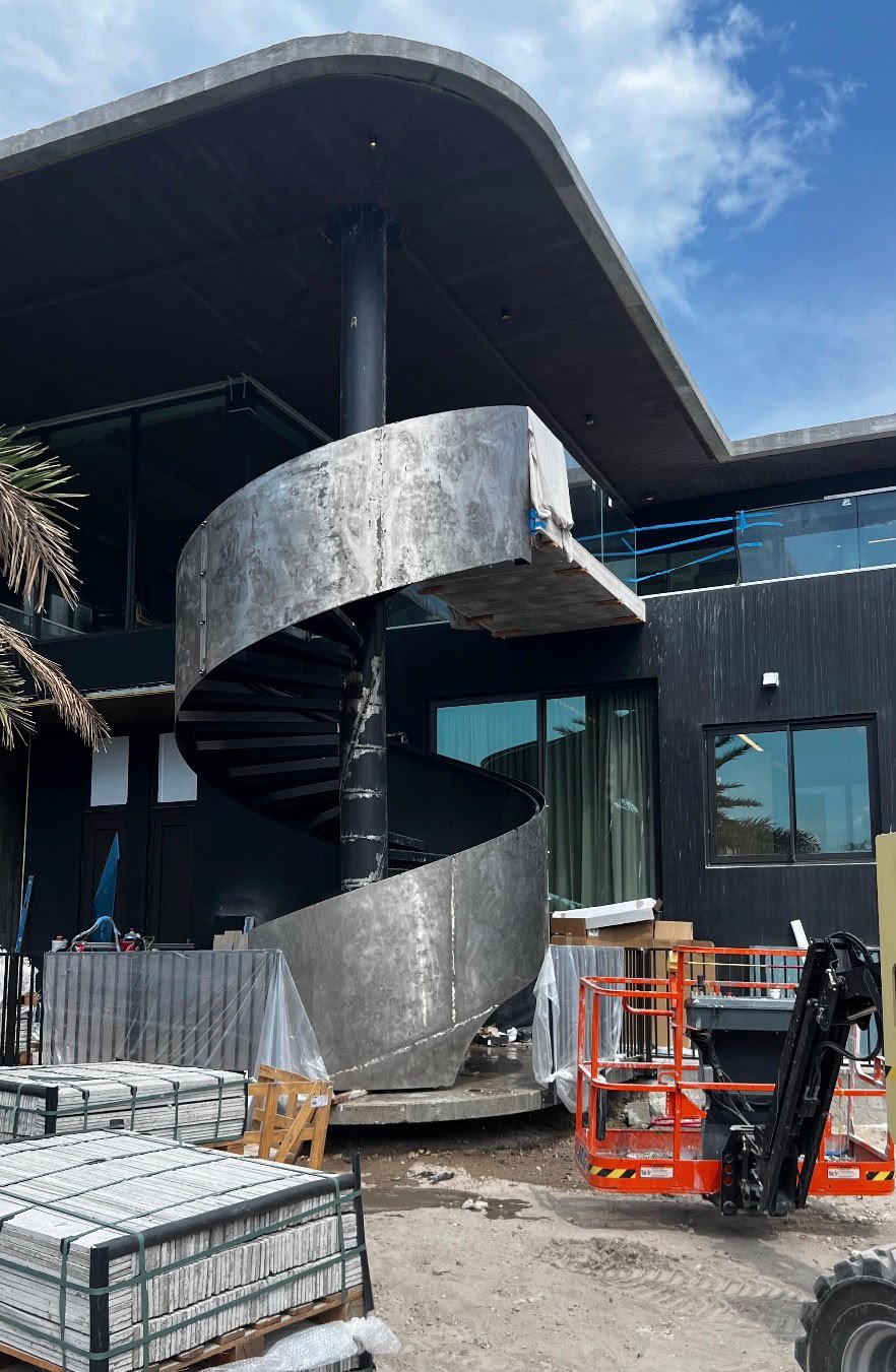 Metal spiral staircase before surface preparation and refinishing in South Florida