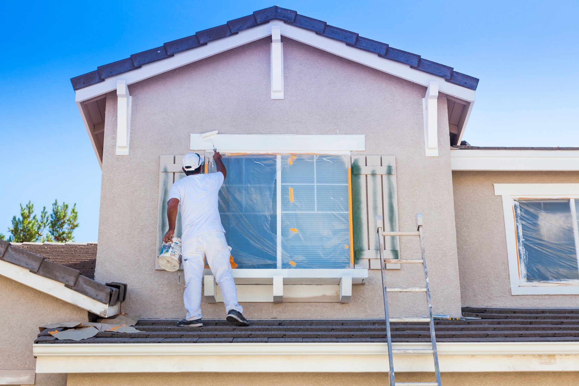Exterior aluminum window frame being refinished on site on a South Florida building